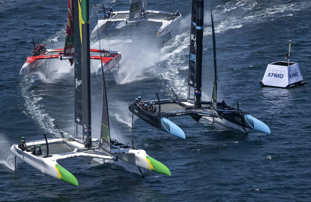 Four 50‑foot catamarans race across the water at Sail GP.