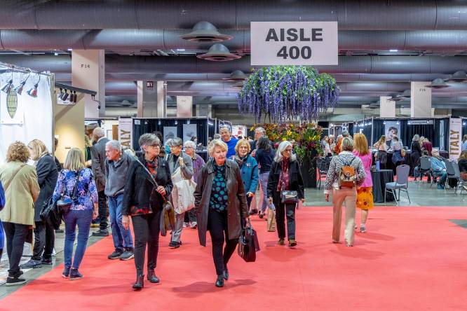 people walking around the craft show