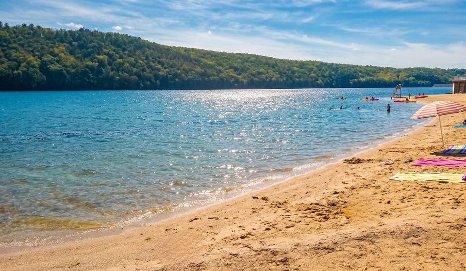 The most beautiful inland beach in Pennsylvania is in the Poconos only 1.5 hours from Philly — with a 525-foot sand beach &amp; scenic mountain views