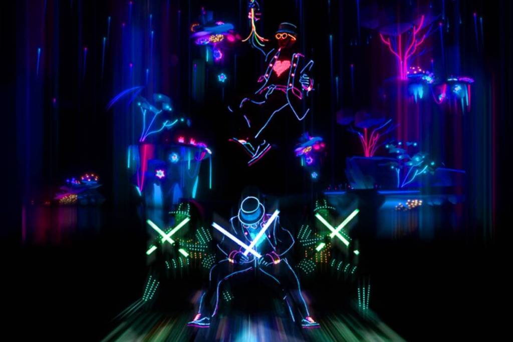 Dancers lit up on stage