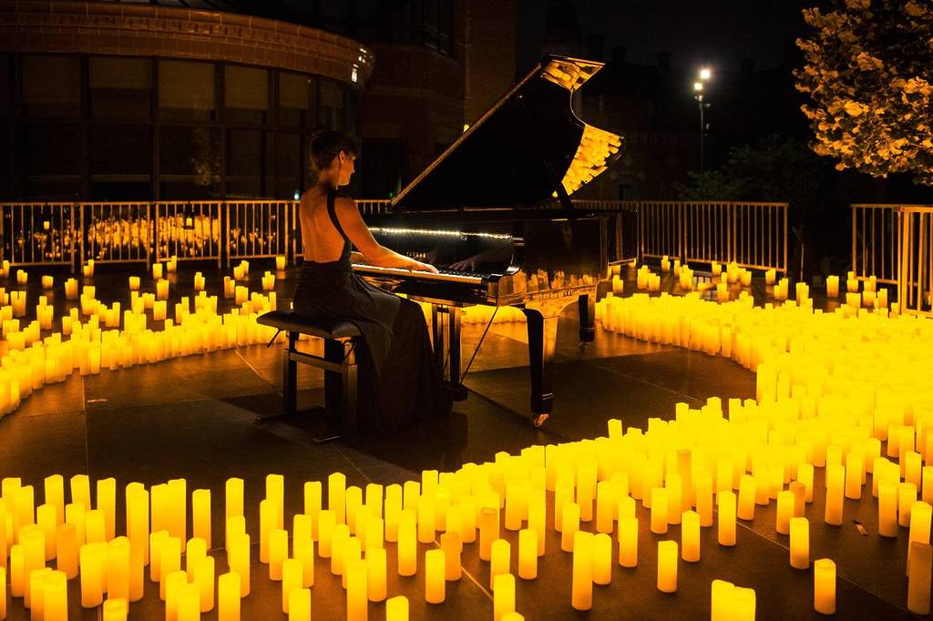 A pianist plays at a Candlelight Open Air concert.
