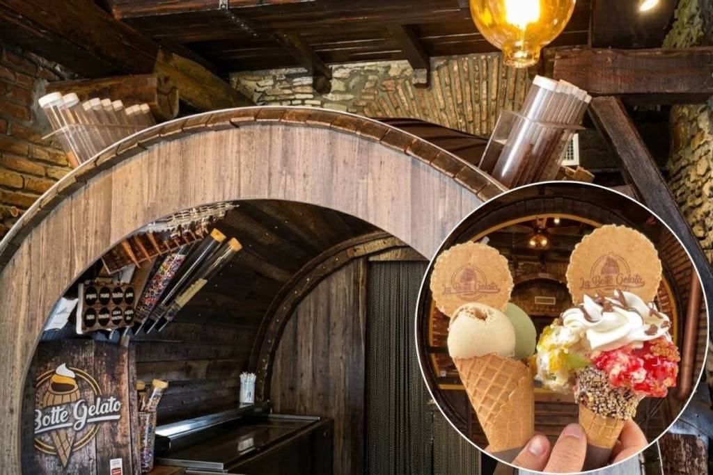 Coni gelato artigianali con panna e granella davanti al banco in legno della gelateria La Botte Gelata.