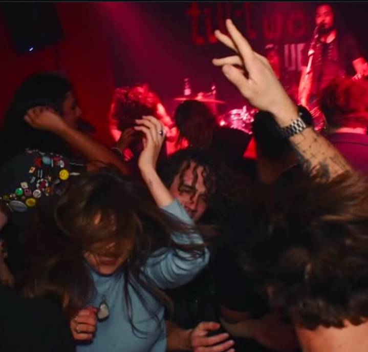 people dancing at a bar