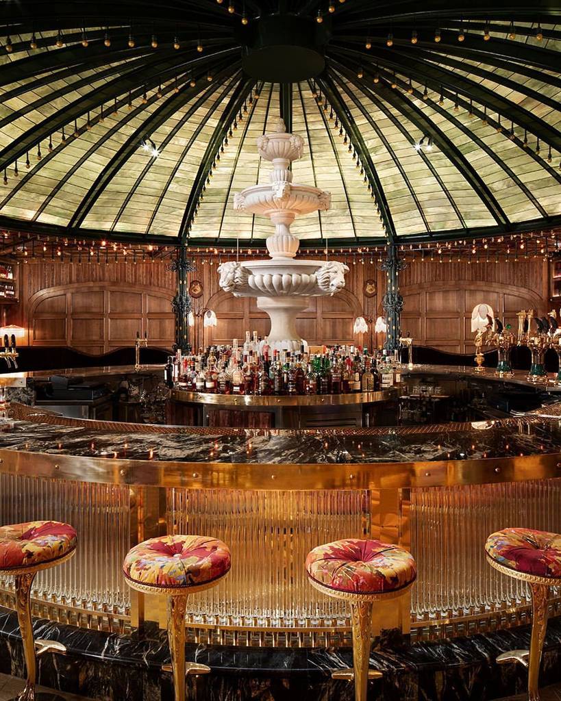 Ornate bar with a fountain and glass dome