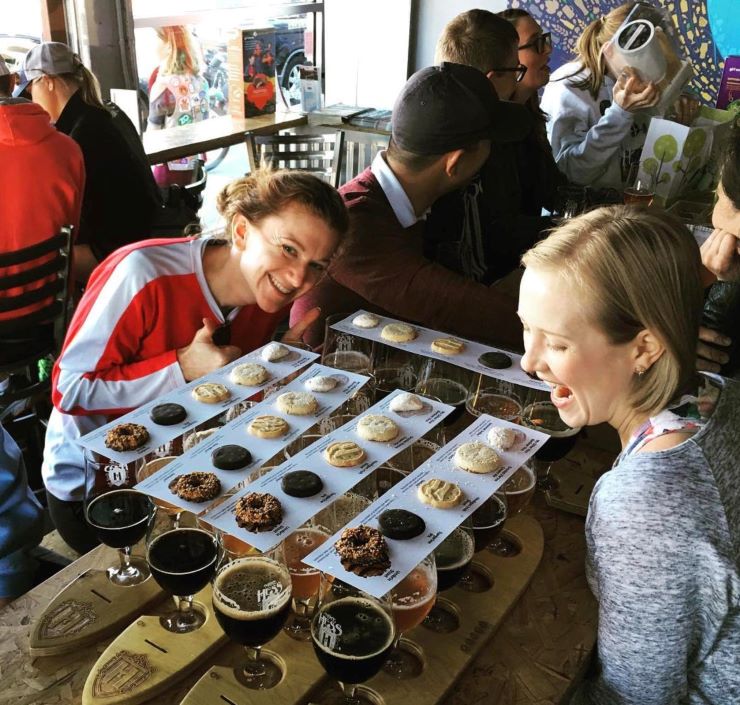 women enjoying a tasting with cookies