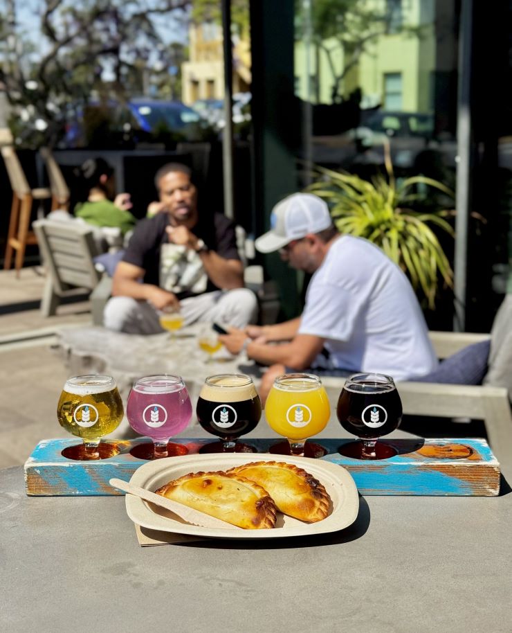 craft beer flight and empanadas