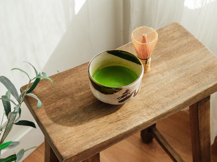 a cup of Matcha on a wooden table