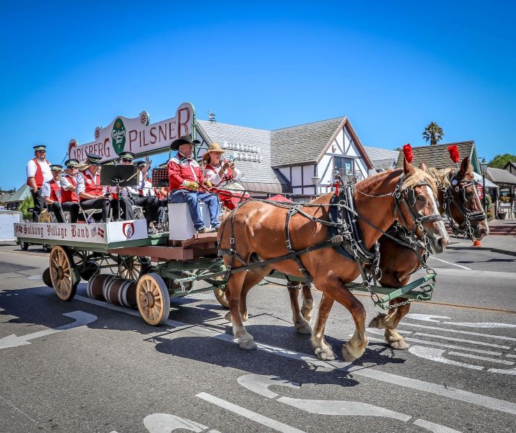 people in a Carlsberg carriage at a Danish celebration