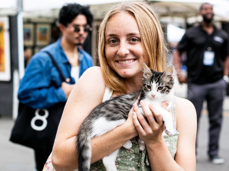 a woman holding a cat