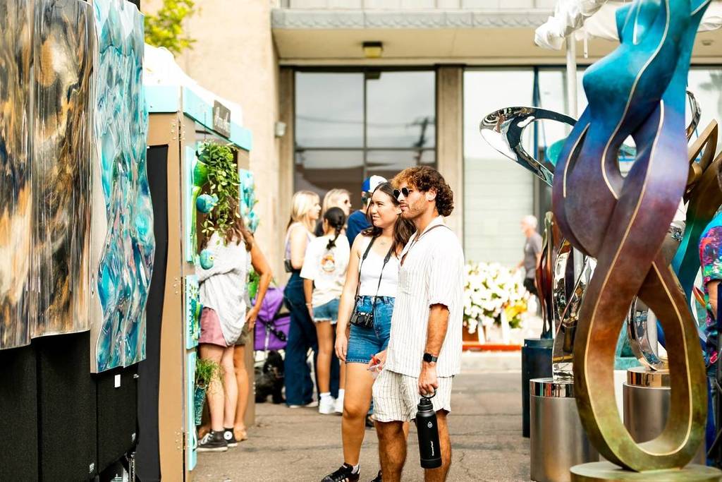 two people looking at art at La Jolla Art & Wine Festival