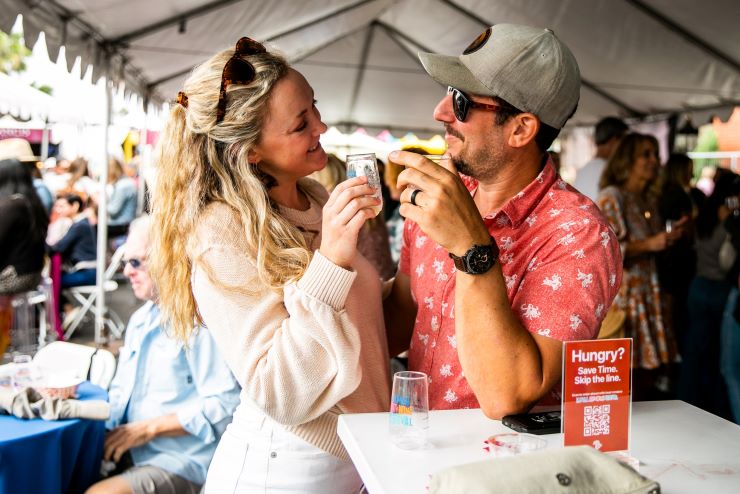 couple enjoying drinks at a festival