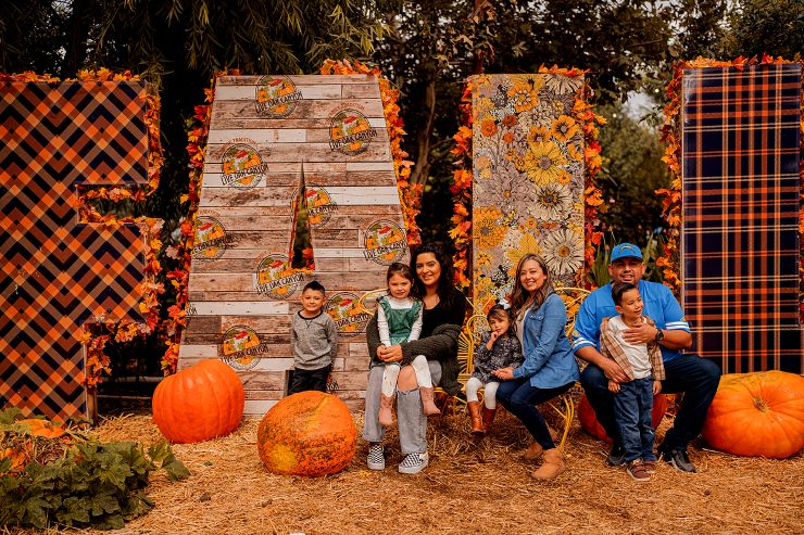 family with fall decor