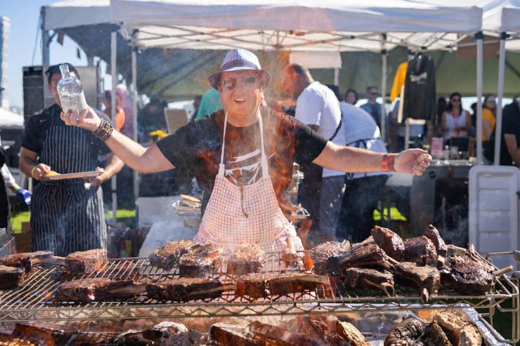 man in front of BBQ at San Diego Food and Wine Festival