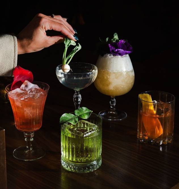 line-up of colorful cocktails and mocktails