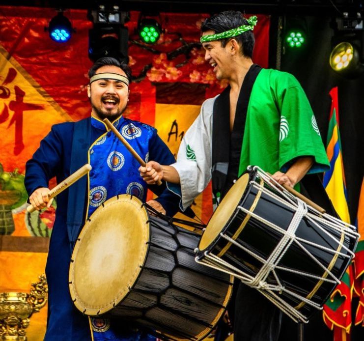 people playing Taiko Drums