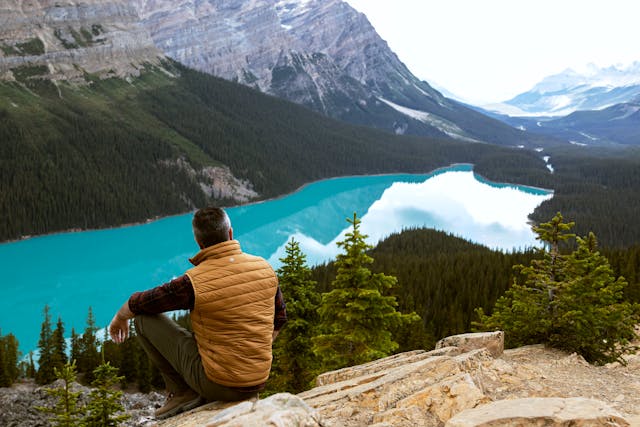 man next to lake in AB, Canada