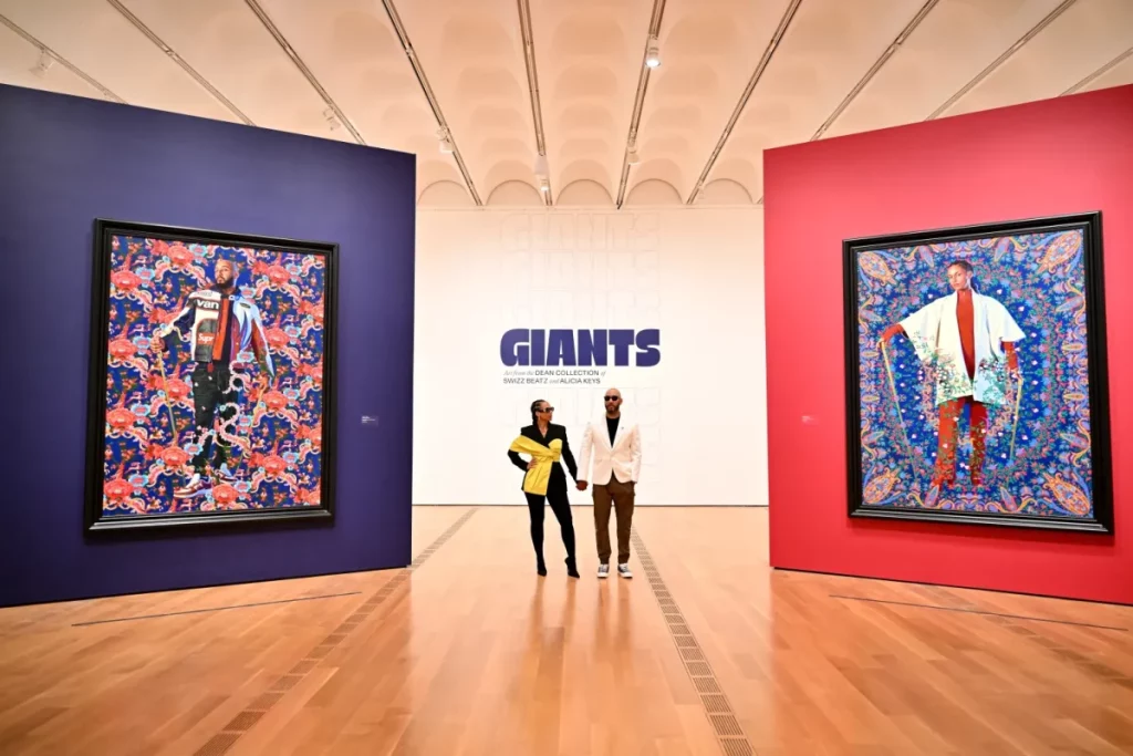 Alicia Keys and Swizz Beatz in a museum with their art collection