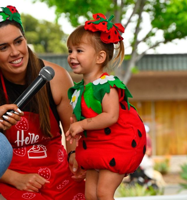 kid dressed as a strawberry