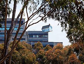 A 70,000-pound baby-blue house is teetering off an engineering building at UC San Diego – and you can actually step inside its tilted interior