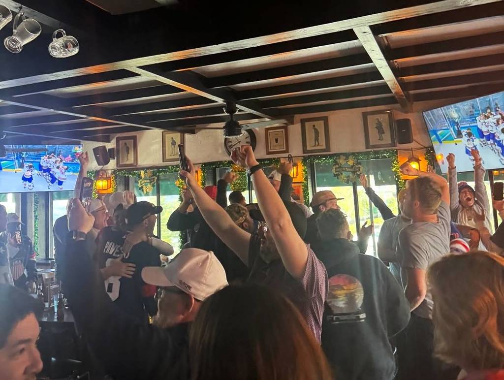 people enjoying the game at a sports bar