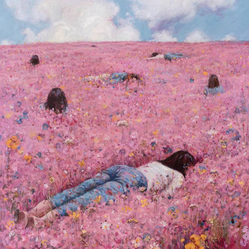 girl laying in a pink flower field