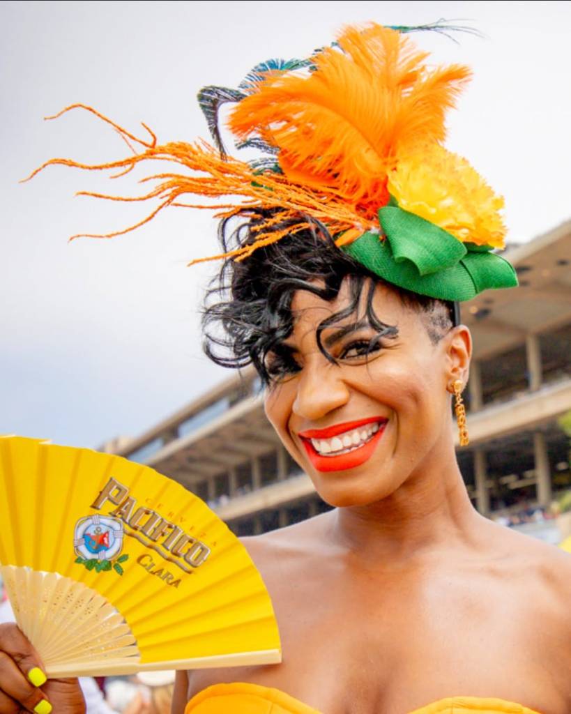woman wearing an extravagant flowery hat