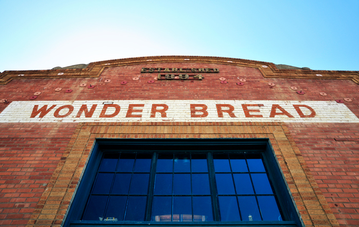 text on red brick building saying 'Wonder Bread'