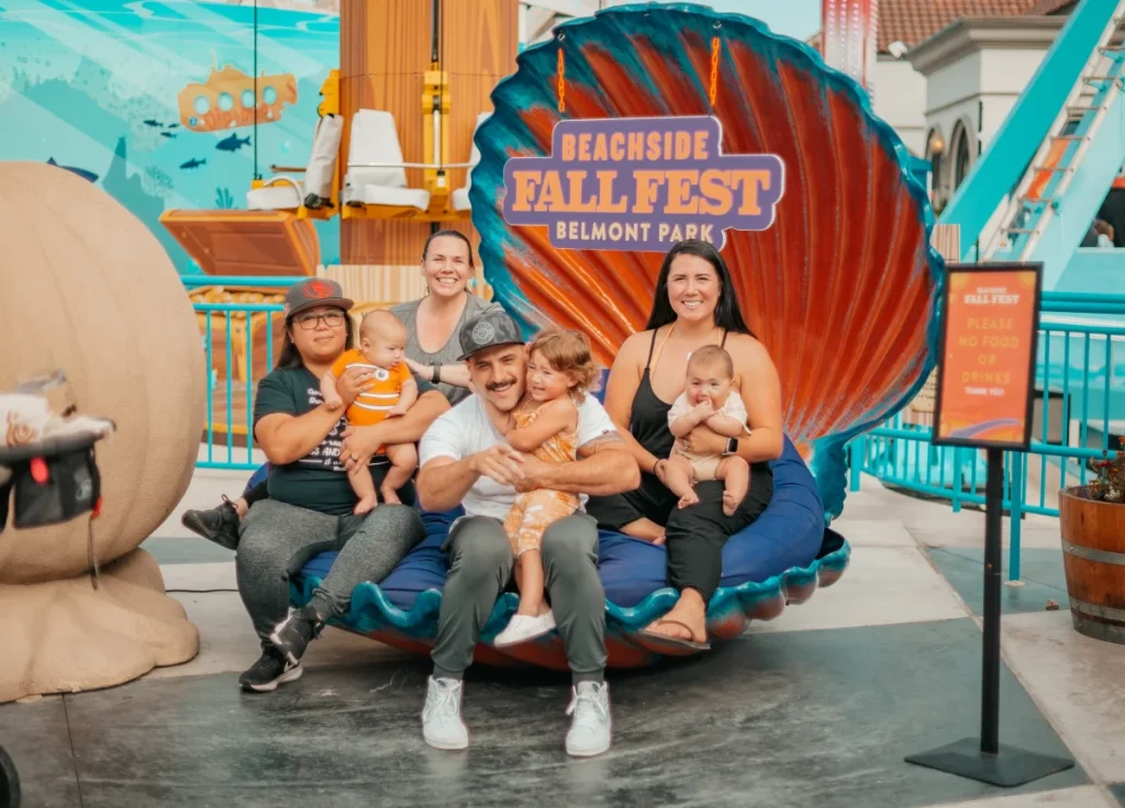 family at a beach fall festival in San Diego