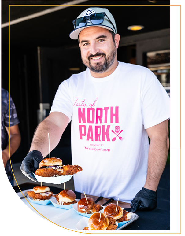 person serving food at Taste of North Park