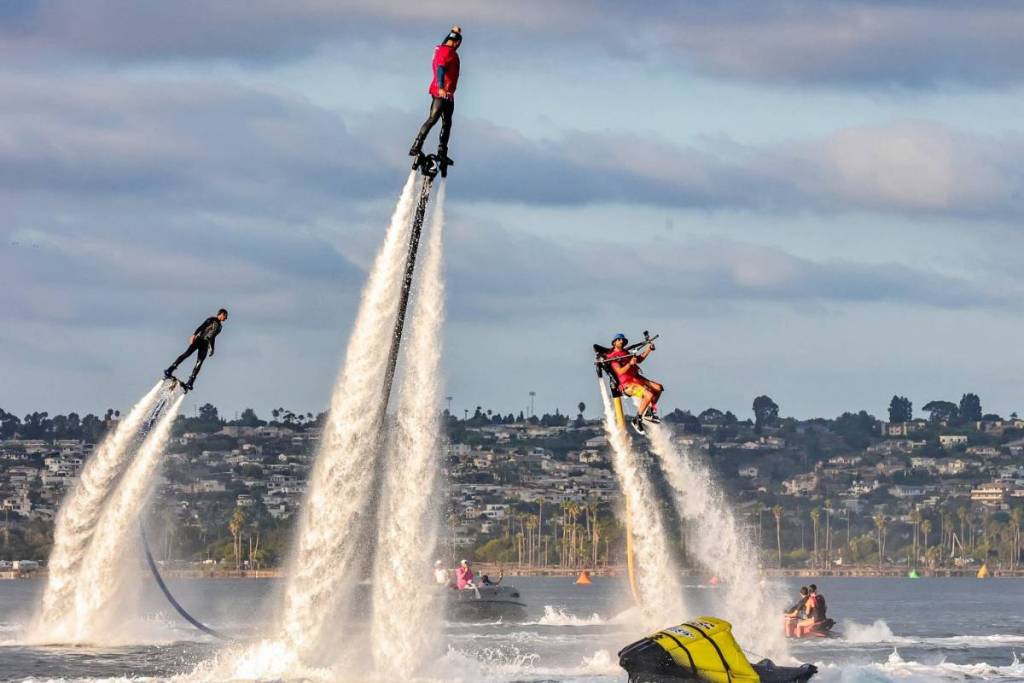 people doing tricks in the water