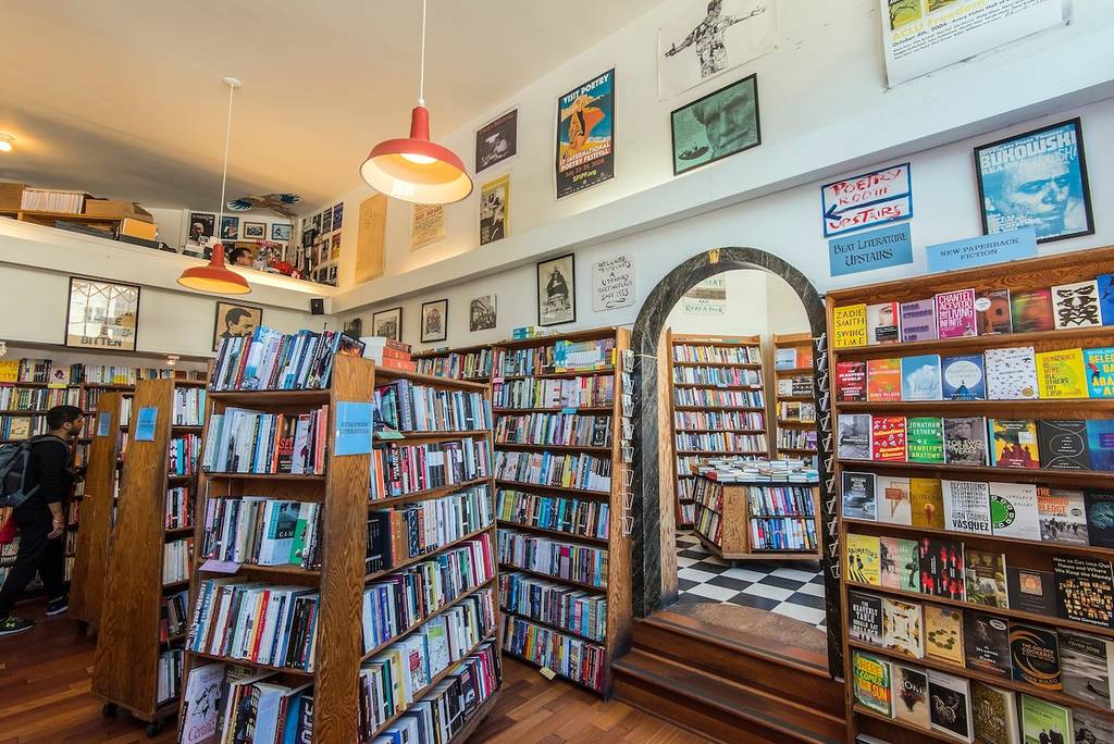 a bookstore with shelves and an archway