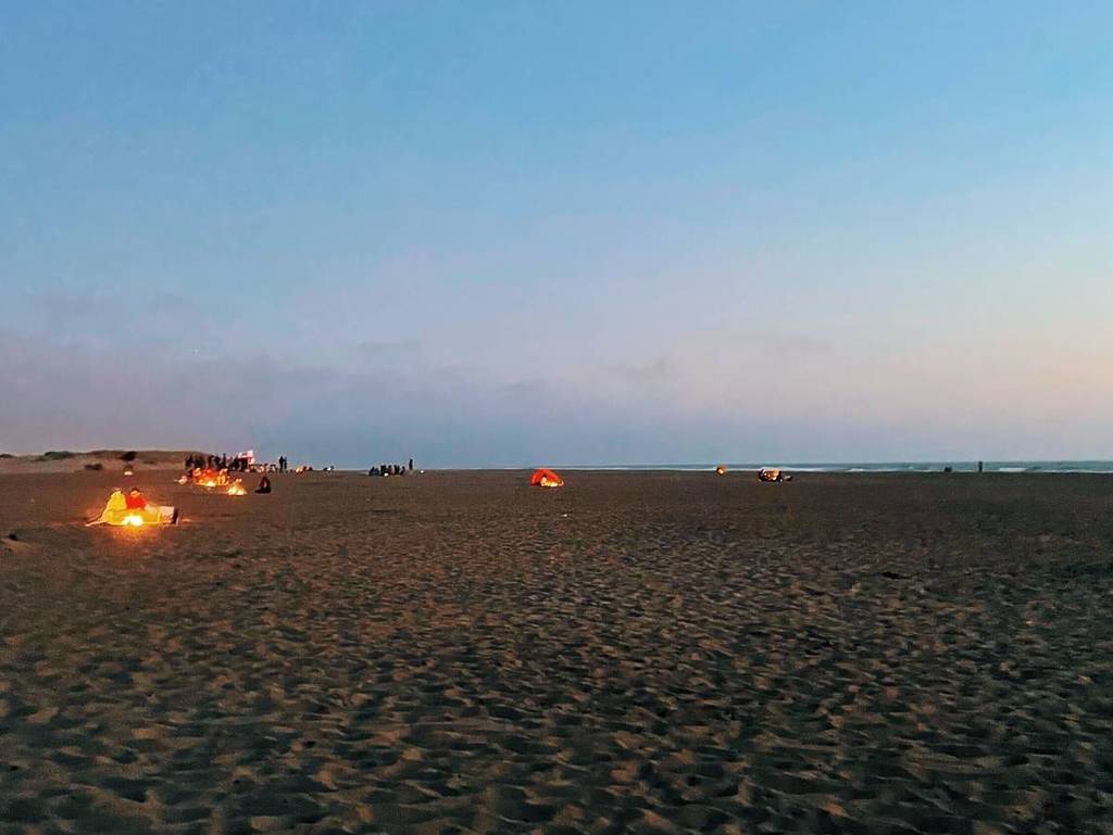 bonfires at sunset at Ocean Beach in SF