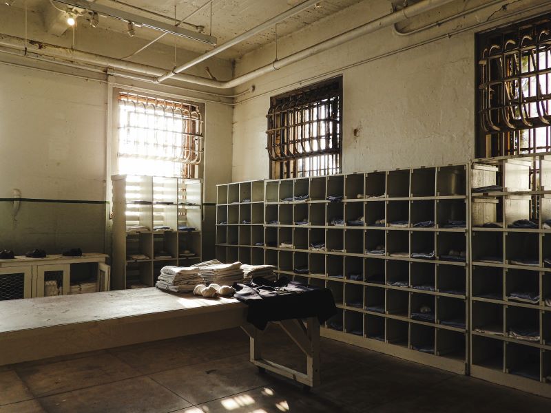 Interior of Alcatraz Prison with cubbies and a long table.