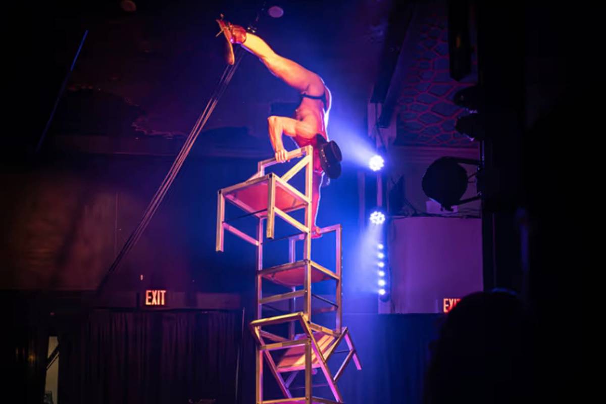 aerial acrobat doing chair stunt