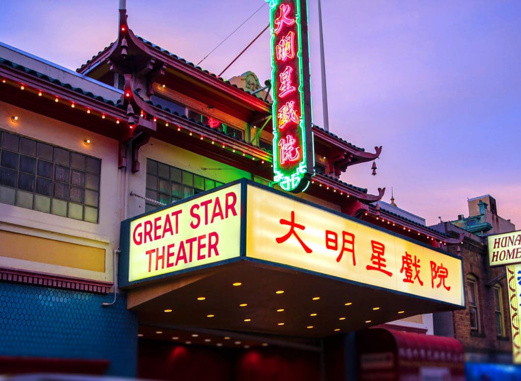 The glowing facade of Great Star Theater where classical concerts unfold.
