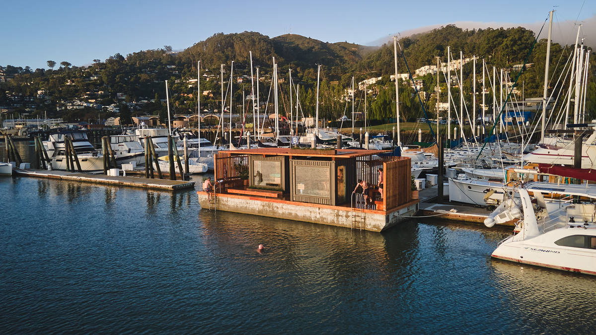 a floating sauna on a sunny day in the bay