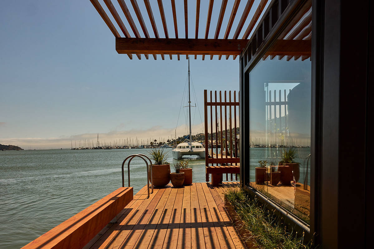 a floating sauna on a sunny day in the bay