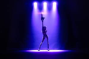 Burlesque performers wear horror-themed outfits