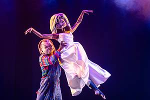 Burlesque performers wear horror-themed outfits