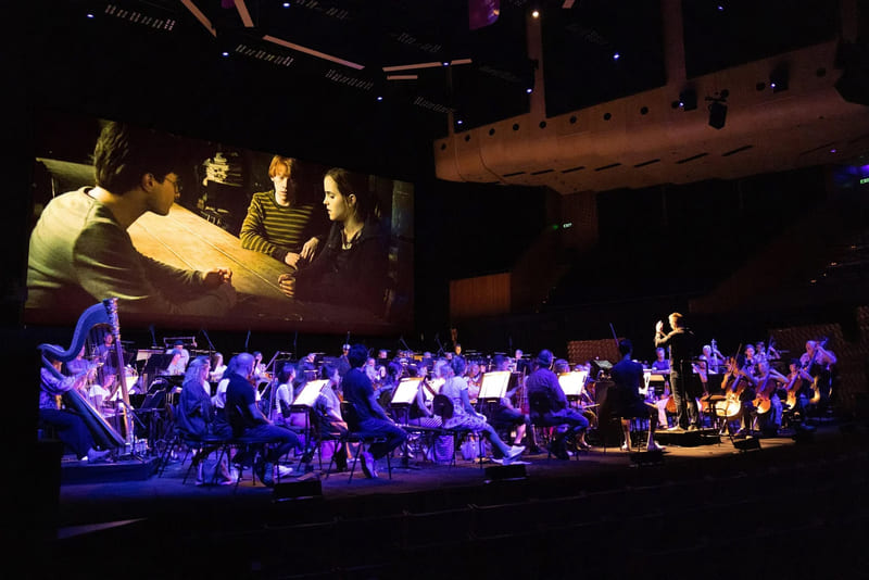 A live symphony orchestra plays at the Harry Potter film concert series