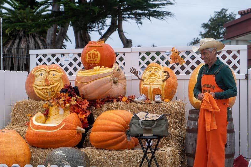 Farmer Mike with his pumpkin sculptures at the Half Moon Bay Pumpkin Festival.