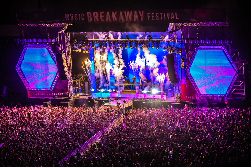 Performers with fire effects at Breakaway Music Festival