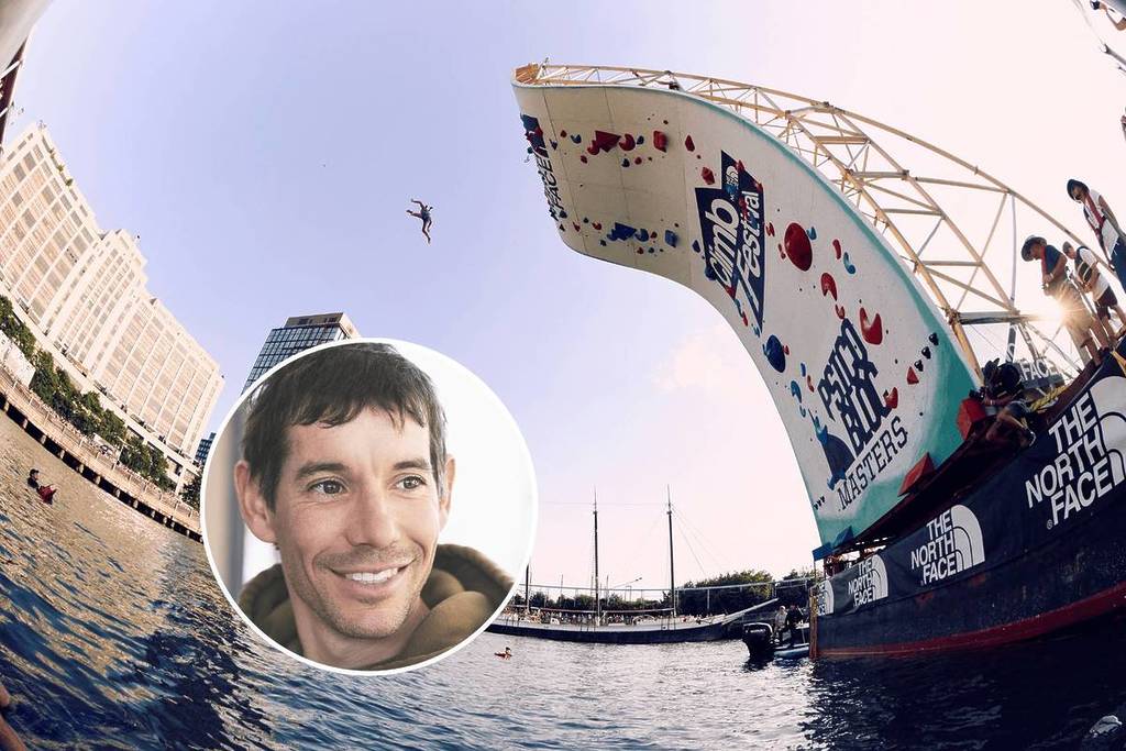 A 45 foot climbing wall and portrait of Alex Honnold at the North Face Climb Festival