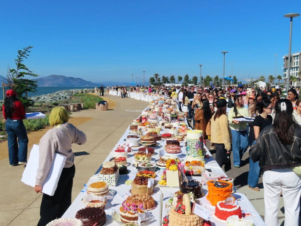 Cakes and a large crowd of people