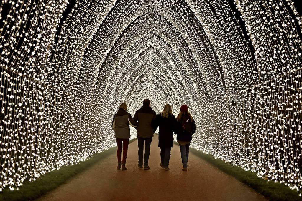 people in a tunnel of lights