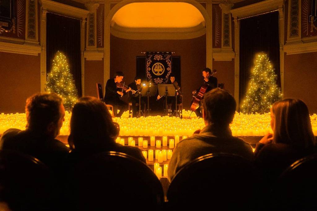 candles on stage at a festive candlelight concert