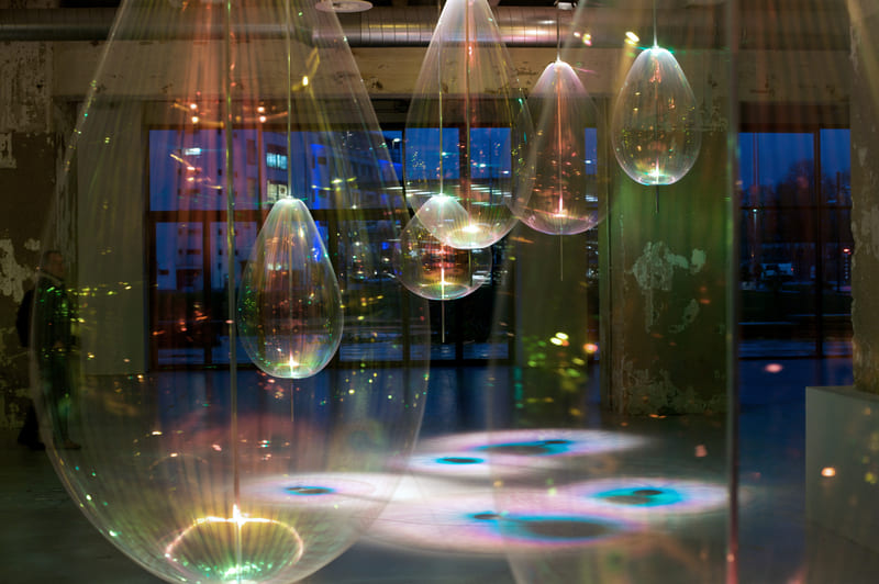 Art installation featuring suspended hanging bubbles