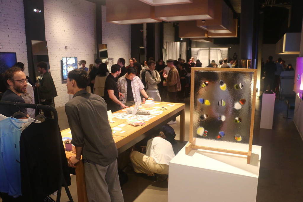 people in a new art gallery in SF