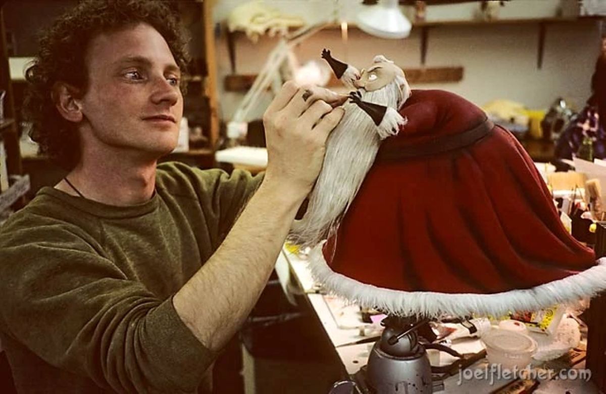 man creates puppet of santa as part of the nightmare before christmas production