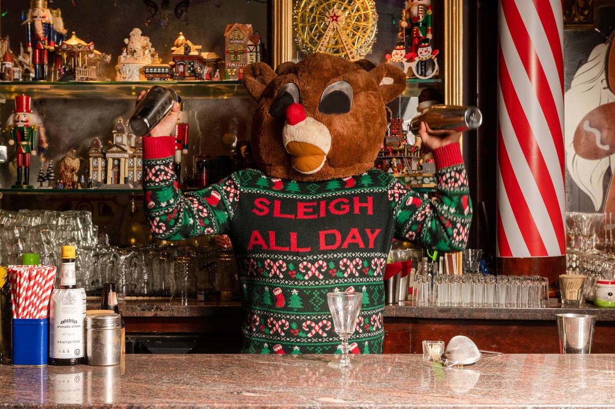 person making drinks in a holiday bar
